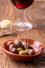 mixed olives on dark wood