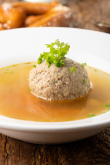 bavarian liver dumpling soup on wood