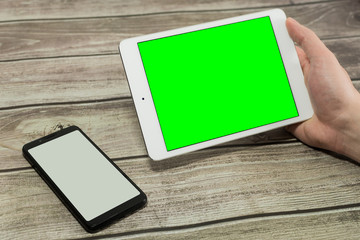 Tablet with green screen.