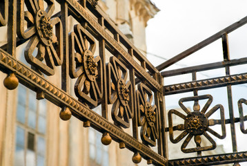 decorative elements of a wrought-iron fence