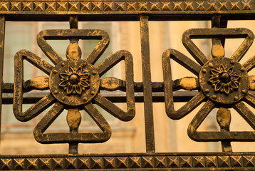 decorative elements of a wrought-iron fence