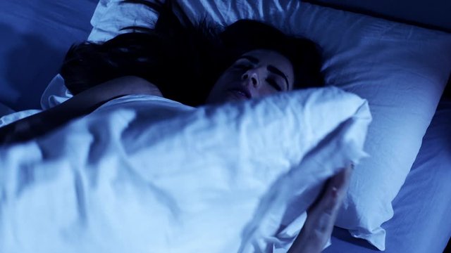 Woman unable to sleep suffering of insomnia stressed out