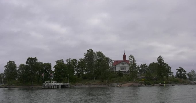 4K Helsinki Baltic Sea Finnish Bay lagoon, yachts, cruise liners view on cloudy summer day video, Luoto Island green park, old beautiful red roof mansion in Finland, northern Europe
