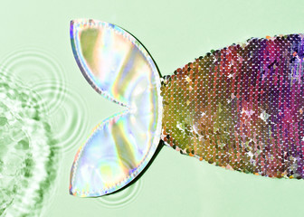 Mermaid tail underwater transparent sunlight shine skin with splashing, top view