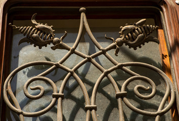 decorative elements of wrought iron grilles in the window