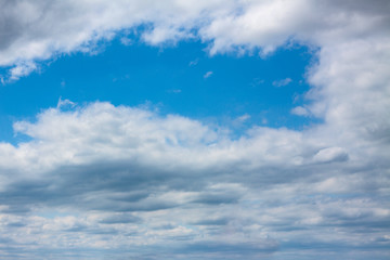 Naklejka na ściany i meble Blue sky with white clouds in spring, sunny weather