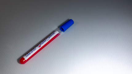 Blurry image of a Sample blood in test tube of Coronavirus (Covid-19). Coronavirus Covid 19 infected blood sample in a test tube