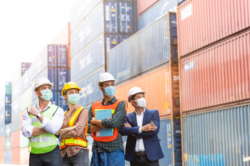 Factory industrial construction site or container warehouse people standing with arms crossed in face mask. Logistic cargo shipping business corporate teamwork successful. New normal, copy space 