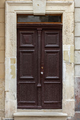 Fototapeta na wymiar Vintage wooden door of antique house in an old city.