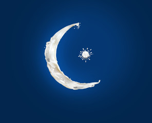 Eid Mubarak- Splash of liquid white milk cream in form of crescent moon and star in dark blue...