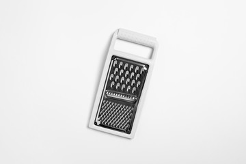 Metal Grater for various food products on a white background. High-resolution photo.