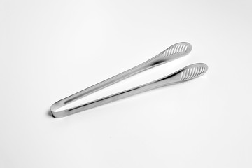 Serving kitchen cooking Tongs isolated on a white background. High-resolution photo.