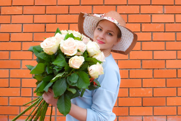 Flowers for you. Beautiful lady with bouquet of roses. Flowers for birthday