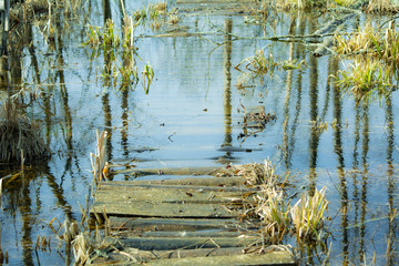 small home-made bridge (masonry) flooded with water during high water