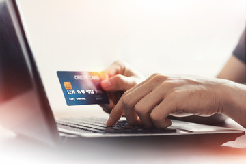 Person using credit card Data entry for E-payment technology for online shopping at home with copy space. shopping lifestyle, or mobile phone financial application concept, credit card mockup