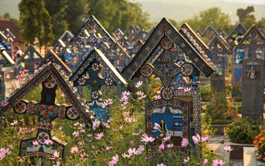 Painted wooden crosses in the beautiful Merry Cemetery, unique and funny monuments Romania