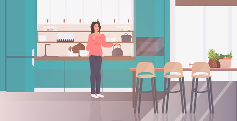 woman holding kettle girl preparing hot drink stay home coronavirus pandemic quarantine concept modern kitchen interior full length horizontal vector illustration