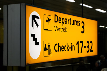 departure and check in sign on schiphol airport 