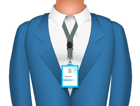 Man in business suite with badge on white backdrop.