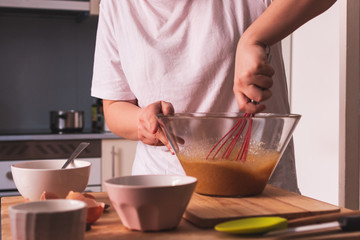 girl mixing dessert dough