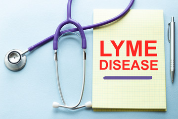 On a purple background a stethoscope with yellow list for you text LYME DISEASE