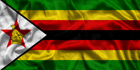 Obraz premium Zimbabwe national flag background with fabric texture. Flag of Zimbabwe waving in the wind. 3D illustration