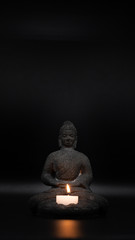 Sitting Buddha Statue with a candlelight