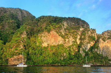 Fototapeta na wymiar Ao Loh Dalum Bay surrounded by limestone formations on Phi Phi Don Island, Krabi Province, Thailand.