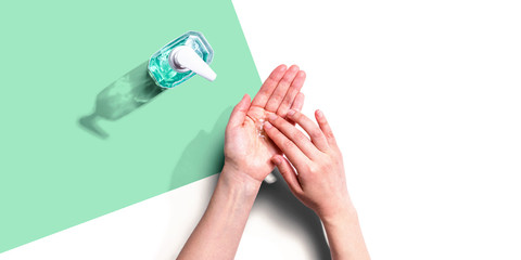 Applying sanitizer gel - healthcare and hygiene concept