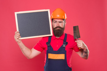 Renovation company services. Professional plasterer. Skillful plasterer. Bearded man worker with...