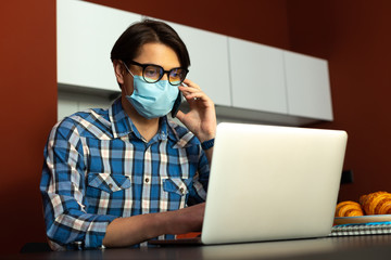 Male using modern technologies for working online during epidemic