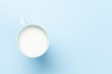 Milk cup on blue background