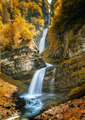 Fototapeta na wymiar view of the idyllic Diesbach creek waterfall in the Swiss Alps near Braunwald and Glarus in the spring