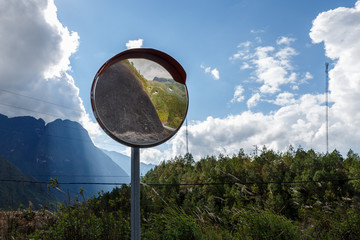 convex spherical road mirror. Road mirror for road safety in the mountains.