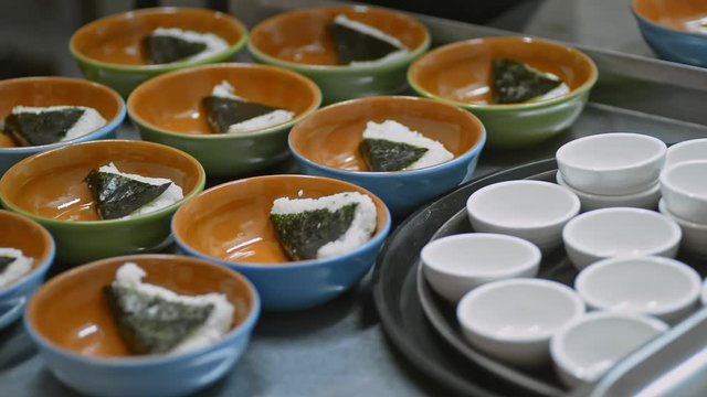 plates with rice and nori lrrl. traditional asian chinese japanese food in restaurant. plate at banquet, buffet, all you can eat restaurant or smorgasbord. concept catering, serving