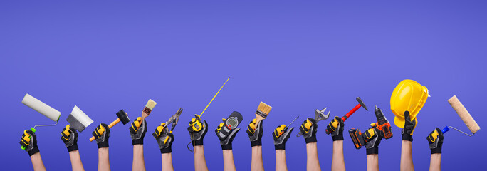 Workers hands with different tools on empty purple background