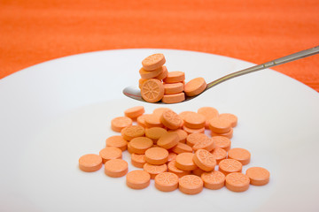 Many tablets and orange vitamin - protection during quarantine, coronavirus, covid19