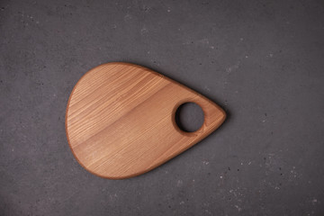 Top view Wooden cutting board on a gray background