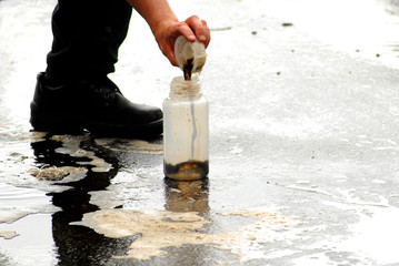 Taking sample to measure the water quality