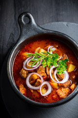 Traditional Hungarian goulash - stew of meat and vegetables with onions