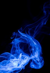 Blue smoke on black background