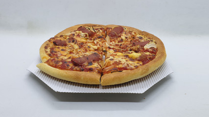 Delicious Clean Tasty Meat and Sausage Italian Pizza Dishes in White Isolated Background
