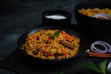 Homemade indian Vegetable / veg biryani with mixed veggies served with raita