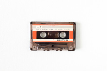 Old tape cassette, old or aged wood background. İsolated casette