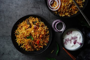 Homemade indian Vegetable / veg biryani with mixed veggies served with raita