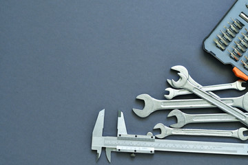 Inscription Fathers Day with different tools on grey background. Flat lay. top view