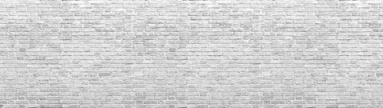Fototapeta Old white brick wall background, wide panorama of masonry