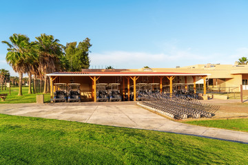 A beautiful green golf course, a house on it. Portugal.