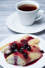 Curd rolls with jam and tea.