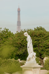 statue in the garden tuileries.   view eiffel tower